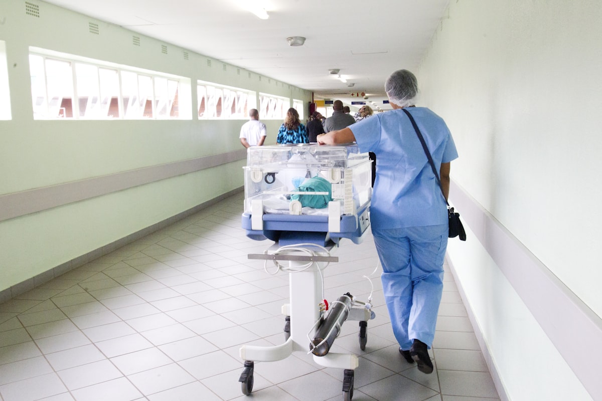 Nurse walking through a hospital hallway during a shift